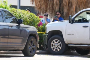 (People watch as Harris County Sheriff deputies work the scene near two vehicles involved after a man was struck by an ICE agent's vehicle during an immigration enforcement operation in northwest Houston, Saturday, Oct. 10, 2026.  Photo: 9Jason Fochtman-Houston Chronicle via AP)
