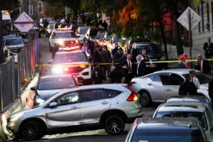 (Law enforcement work the scene of a shooting Thursday, Oct. 8, 2026, in New York.  AP Photo: Seth Wenig)