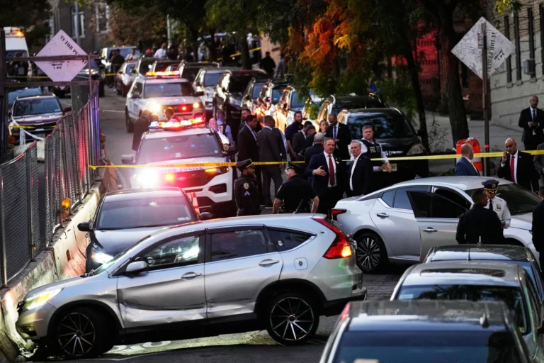 (Law enforcement work the scene of a shooting Thursday, Oct. 8, 2026, in New York.  AP Photo: Seth Wenig)