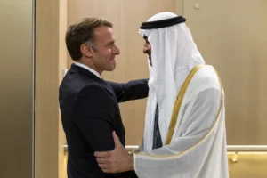 (In this photograph released by the state-run WAM news agency, United Arab Emirates President Sheikh Mohammed bin Zayed Al Nahyan, right, greets French President Emmanuel Macron upon his arrival in Abu Dhabi, United Arab Emirates, Monday, Oct. 19, 2026.  Photo: WAM via AP)