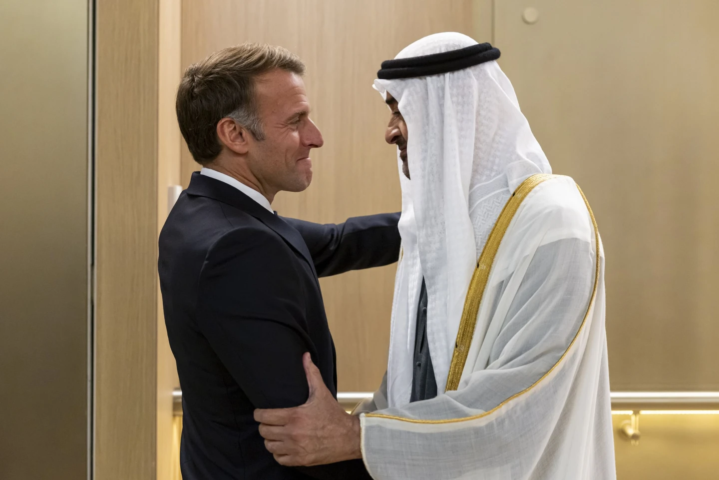(In this photograph released by the state-run WAM news agency, United Arab Emirates President Sheikh Mohammed bin Zayed Al Nahyan, right, greets French President Emmanuel Macron upon his arrival in Abu Dhabi, United Arab Emirates, Monday, Oct. 19, 2026.  Photo: WAM via AP)
