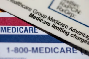 (A Medicare Advantage PPO card rests on top of a Medicare card in Portland, Ore., June 10, 2024.  AP File Photo: Jenny Kane)