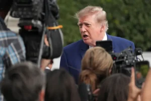 (President Donald Trump speaks to reporters on the South Lawn of the White House, Friday, Oct. 16, 2026, in Washington.  AP Photo: Jacquelyn Martin)
