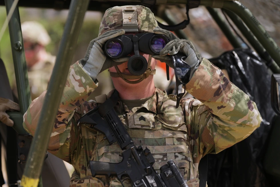 (U.S. Army personnel keep watch over the U.S.-Mexico border in Roma, Texas, Thursday, Oct. 8, 2026.  AP Photo: Eric Gay)