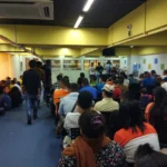 (Nepali migrant workers waiting for their turn at the Nepali consular mission in Malaysia. Photo: Basanta Karki-ILO)